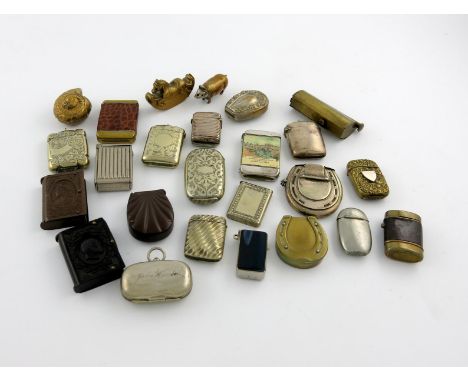 A collection of base metal vesta cases, various designs including: a rocking horse, a pig, three horse shoes, and other desig