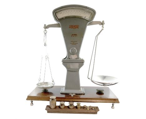 A set of Troy ounce weighing scales, by W and T Avery, of Birmingham, to weigh up to 150 ounces, plus a set of brass weights,