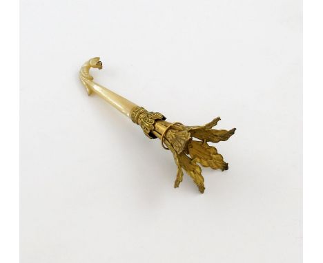 A 19th century gilt-metal posy holder, tapering spread foliate decoration, with a carved mother-of-pearl handle, with a slidi