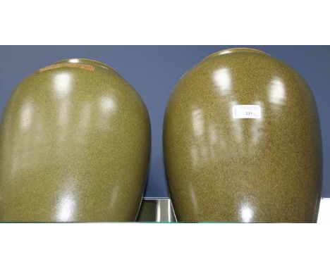 PAIR OF CHINESE CERAMIC LIDDED JARS
in green glaze, mark to body, 37cm and 34cm high respectively