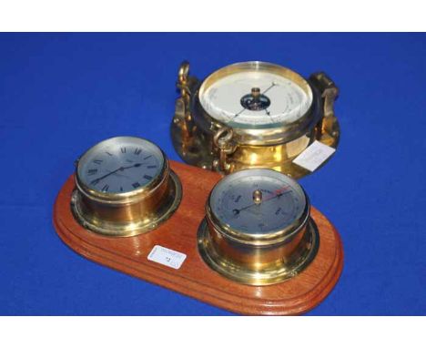 BRASS AND WOOD CLOCK/BAROMETER AND ANOTHER BAROMETER 
the clock/barometer a Sestrel clock with Roman numerals of Chadburns Li