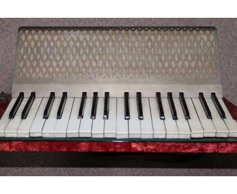 HOHNER CARMEN II GERMAN ACCORDIAN 
with red marble effect enamel, 40cm long