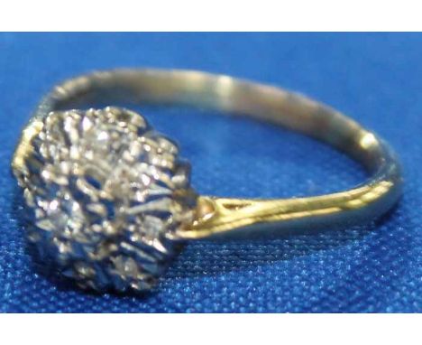 DIAMOND CLUSTER RING
with a graduated, stepped cluster of brilliant cut diamonds, hallmarked eighteen carat gold