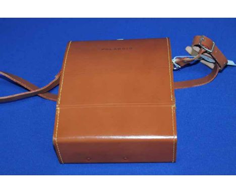 POLAROID ELECTRIC EYE J33 LAND CAMERA
with accessories and film, in fitted leather carry case
