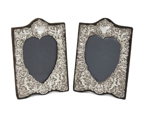 A matched pair of silver mounted photo frames, London, 1991, Keyford Frames and RBB, both of shaped rectangular form with eas