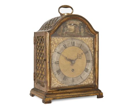 A gilt-brass table timepiece, circa 1800, the arched case with swing handle to top and pierced quatrefoil design to sides and