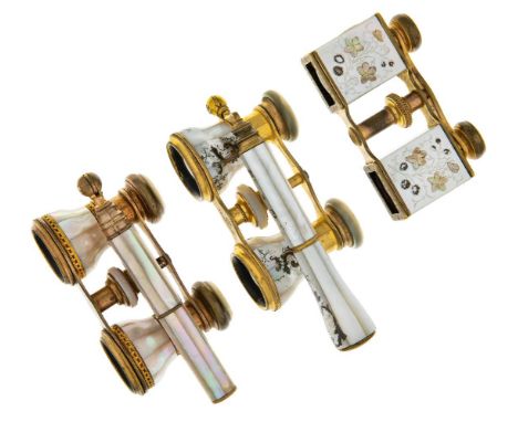 Three French pairs of gilt-brass and mother-of-pearl opera glasses, late 19th century, to include: a pair with handle and bod