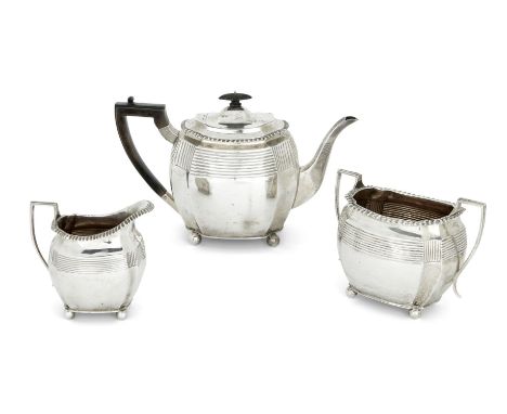 A matched Victorian silver three piece tea service, the sugar and milk London, 1895, Charles Stuart Harris, the teapot London