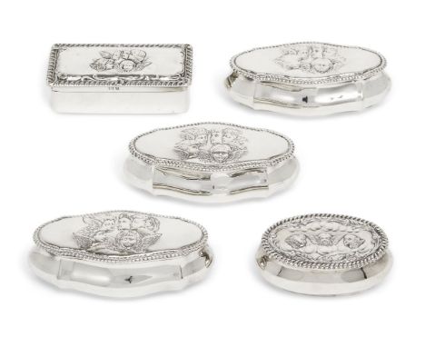 Five putti-decorated silver trinket boxes comprising three shaped oval examples of matching design, one Chester, 1899, James 