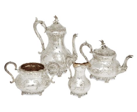 A four piece Victorian silver tea service, Sheffield, 1856 (coffee pot), 1864 (teapot), sugar and milk (both 1866), Martin, H