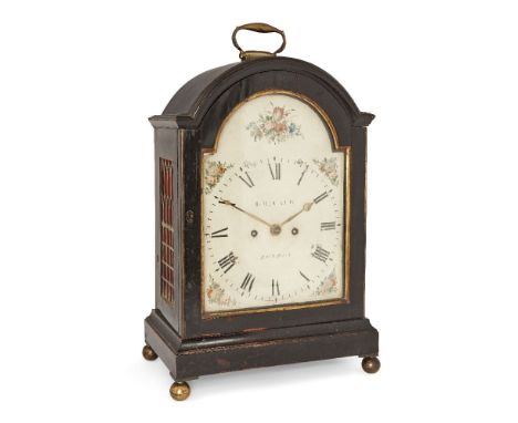 A George III ebonised bracket clock, by T. McCaeb, early 19th century, the ebonised case with break arch top with brass handl