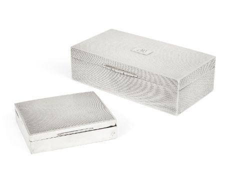 A Garrard & Co. silver cigarette box, Birmingham, 1953, of rectangular form with engine turned lid and sides, the lid opening