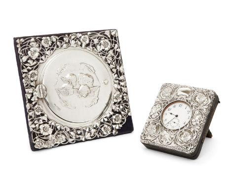 An Edwardian silver mounted photo frame with putti-decorated cover, London, 1902, William Comyns & Sons, the square frame dec