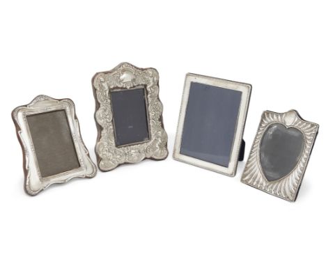 Three silver mounted photo frames comprising: a late Victorian silver example, London, 1898, William Comyns, the lobed frame 