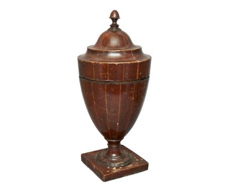 A Georgian urn-shaped mahogany knife/spoon box, line inlaid, the lid with acorn finial supported by a central post and the in