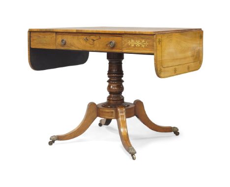 A Regency rosewood and brass-inlaid sofa table, circa 1820, single drawer, raised on a turned stem column, sabre legs to bras