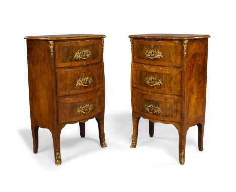 A pair of French burr walnut serpentine front bedside commode chests, 18th century, with walnut crossbanding, three drawers, 