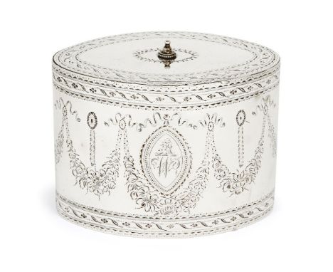 A George III silver tea caddy, London, 1786, Robert Hennell I, of oval form, the sides bright cut with floral garlands surrou