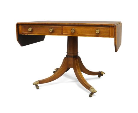 A Regency rosewood pedestal sofa table, the drop leaves with canted corners and boxwood stringing, two frieze drawers on octa