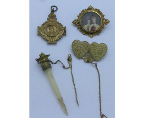 A Mizpah brooch, a commemorative brooch and fob and a mother of pearl scarf pin