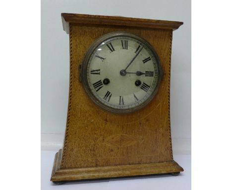 An oak cased Arts and Crafts mantel timepiece, with label to case back, Teutonia, P.H. & S., made in Baden, 30.5cm