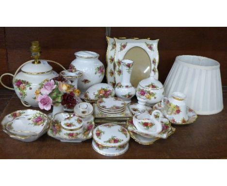 A collection of Royal Albert Old Country Roses china, a table lamp, posies, trinket boxes, a lidded jar, place mats, etc.