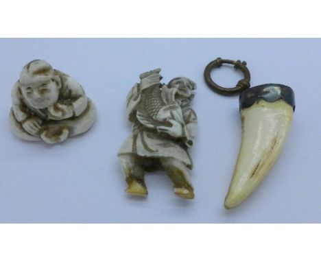 A carved netsuke, one other carved figure a/f and a mounted tooth