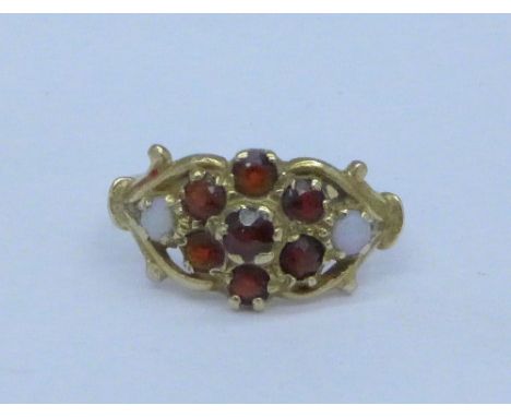 A 9ct gold, garnet and opal ring, 1.9g, J