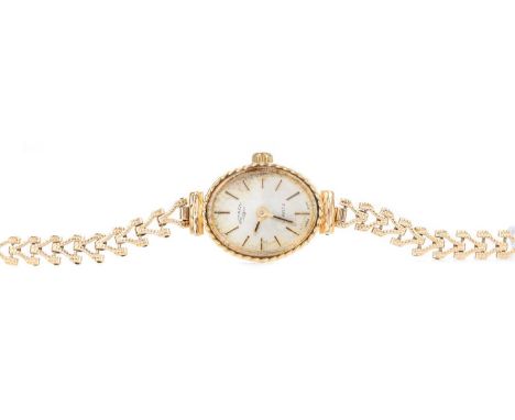 LADY'S ROTARY NINE CARAT GOLD QUARTZ WRIST WATCH,the oval cream dial with baton hour markers, 14mm case, on a nine carat gold