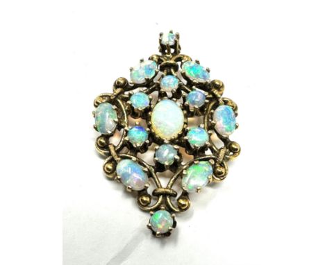 fine 14ct gold opal pendant /brooch measures approx 4cm by 2.7cm weight 8.2g 