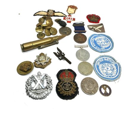 selection of military items inc bullet lighter cap badges buttons patches etc 