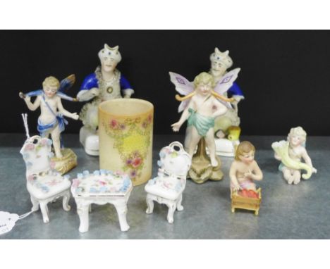 Pair of Staffordshire figures, small beaker vase, a group of four continental bisque porcelain cherubs and a three piece porc