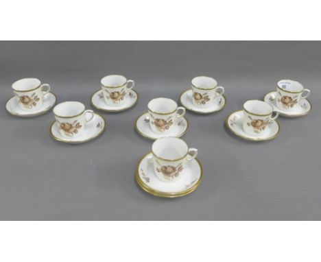 Royal Copenhagen porcelain demi tasse cups and saucers with floral sprays and gilt edged rims comprising eight cups and nine 