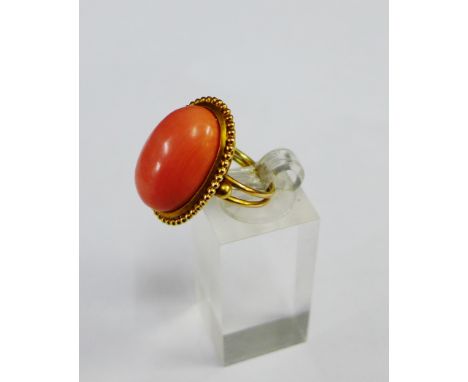 Coral set dress ring on a yellow metal band, UK ring size M