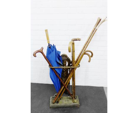 Brass stick stand, together with a collection of  walking sticks (a lot) 