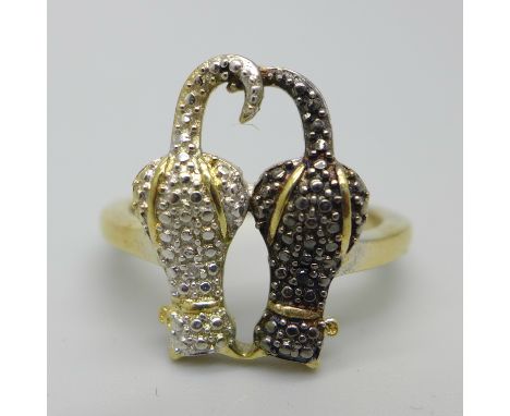 A silver gilt cat ring, each cat set with a diamond accent, P 