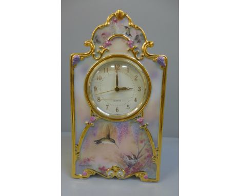 A Bradford Exchange Garden Whispers Heirloom porcelain clock, 23cm 