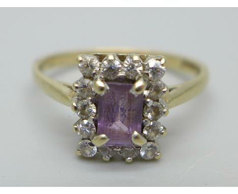 A 9ct gold ring set with an emerald cut amethyst and cubic zirconia, 2.1g, O 