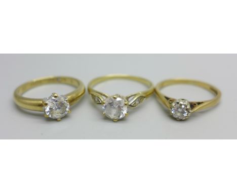 Three 9ct gold rings - the ring with the smallest central stone tests as a diamond, L, one engraved I Love You to the inner s