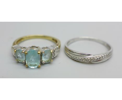 A 9ct white gold ring and a 9ct yellow gold ring, blue stones test as topaz, white stones test as diamonds, 3.7g total weight