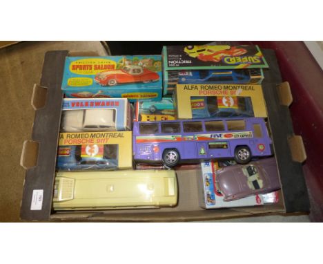 A box of vintage plastic friction model cars and buses 