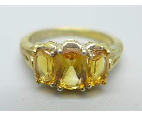 A silver gilt and citrine set trilogy ring, N 
