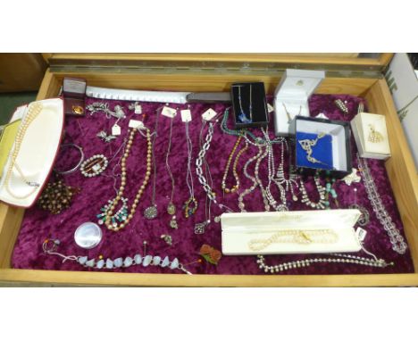 A collection of vintage costume jewellery including Art Deco- necklaces, brooches, buckles, bracelets, two boxed faux pearl n