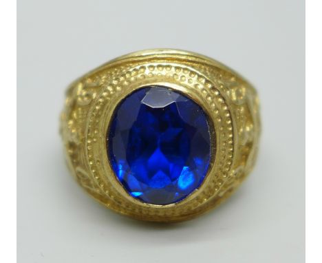 A 9ct gold 1961 Graduation ring set with a large blue stone, 7.8g, X 