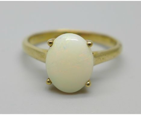 A 9ct gold solitaire ring set with an opal, 1.9g, N 