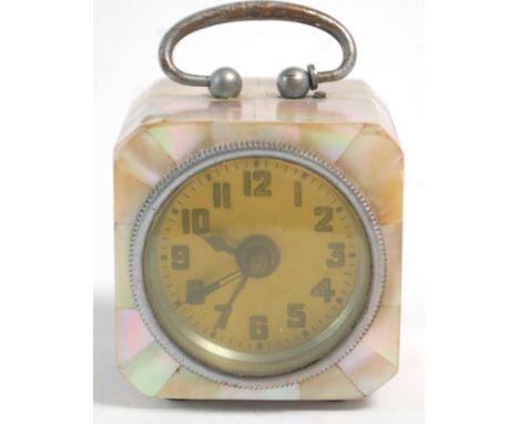 A lovely vintage 20th Century miniature brass and mother of pearl alarm clock of cube form having a yellow face with Arabic n