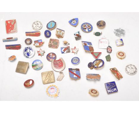 A collection of vintage pin badges dating from the early 20th Century. Multiple enameled examples to include Navy League Keep