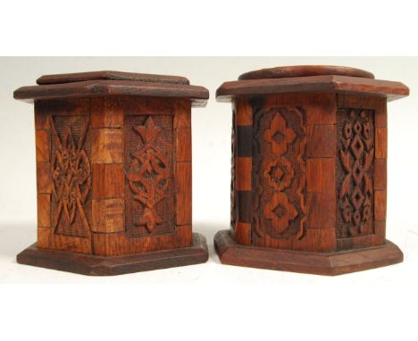 A rare pair of 18th Century Italian carved oak spice caddies of hexagonal form raised on flared plinth bases with carved pane