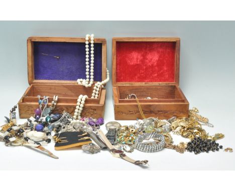 A mixed collection of vintage costume jewellery to include various rings, bracelets, multiple necklaces, faux pearl examples,