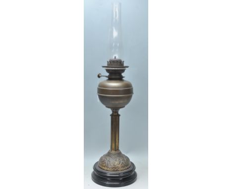 A good late 19th Century Victorian brass oil lamp by&nbsp;E.J. Shaw &amp; Co having repousse floral decoration raised on a eb